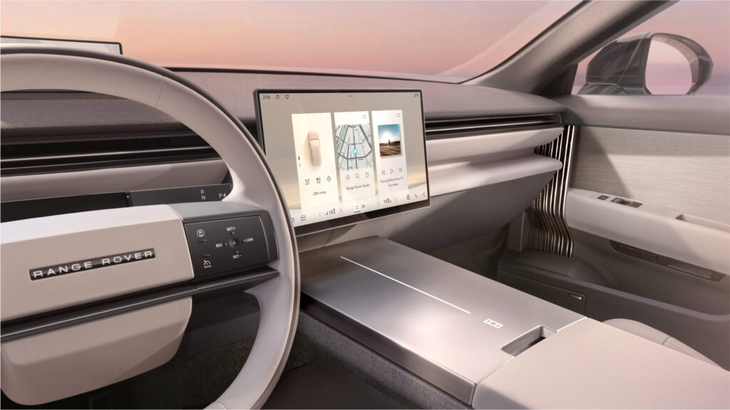 Range Rover GT Innenraum mit zentralem Touchscreen, schlichtem Lenkrad und minimalistischer Mittelkonsole