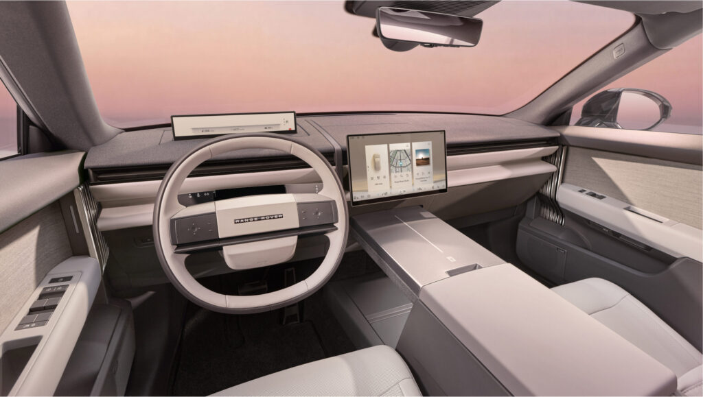 Range Rover GT Interieur mit eckigem Lenkrad, großem Touchscreen und minimalistischem Armaturenbrett