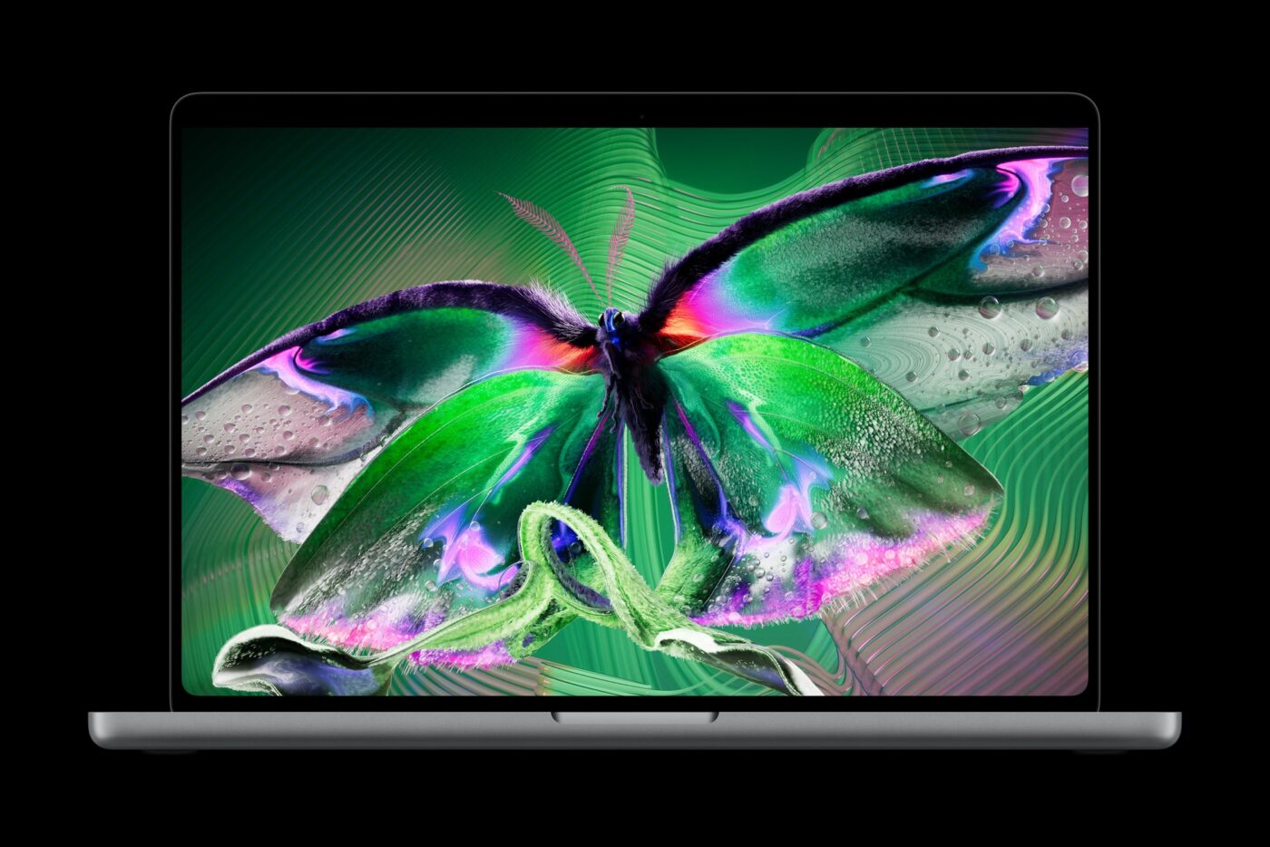 Apple MacBook Pro mit PROLED XDR Display zeigt bunten digitalen Schmetterling in Grün und Lila