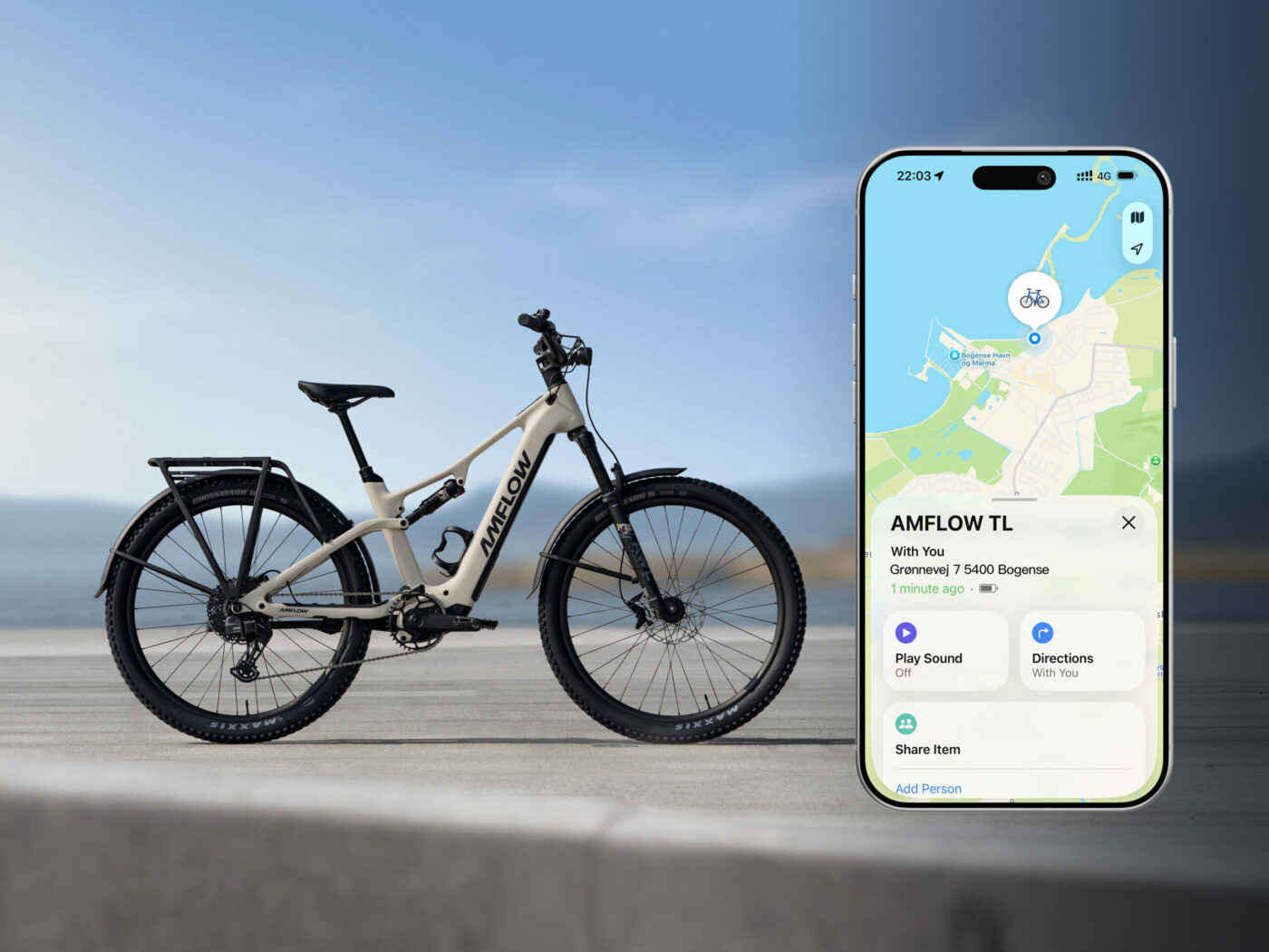 Amflow TL Carbon Pedelec in Beige neben iPhone mit Apple-Maps-Tracking des E-Bikes