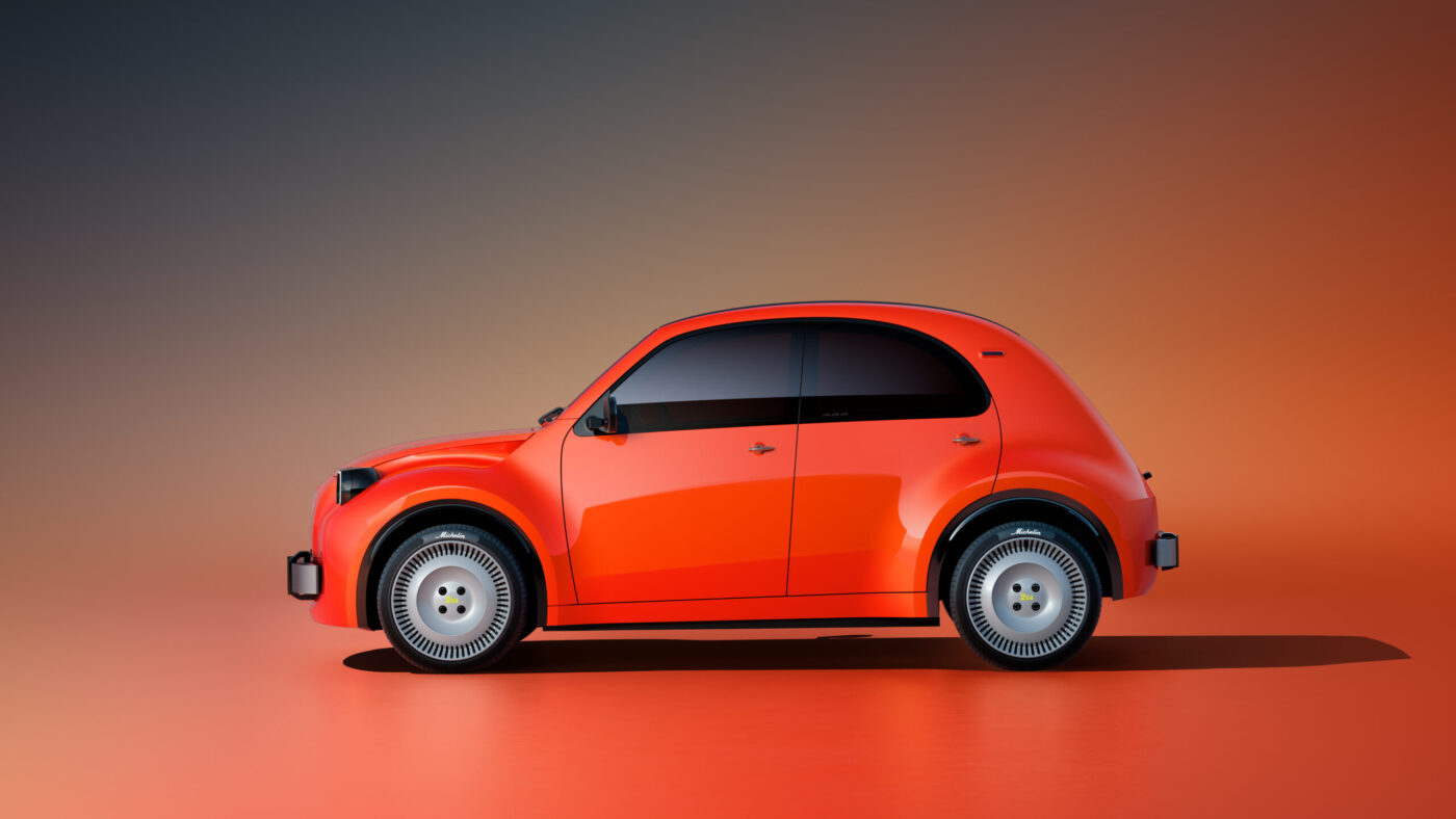 Citroën 2CV Elektro-Konzept in Rot, Seitenansicht, mit weißen Michelin-Felgen auf orangem Studiohintergrund