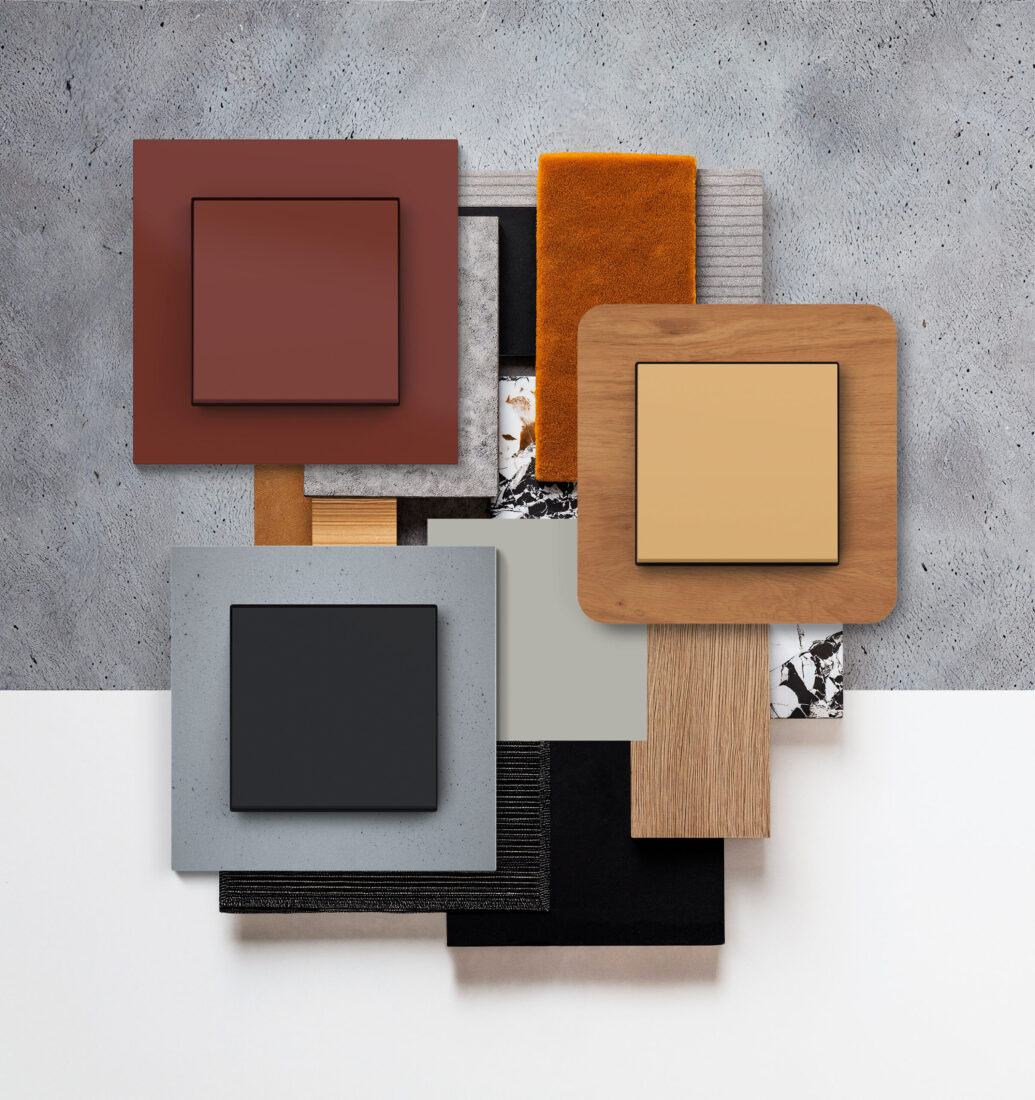 Hager Signature Schalter in drei Varianten – Terrakotta, Beton und Holz – mit Materialproben als Moodboard
